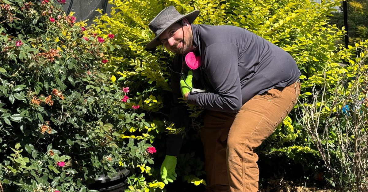 Eric Pope, Vice President of Preferred Pest Management, inspecting landscaping during a pest control service in North Texas"