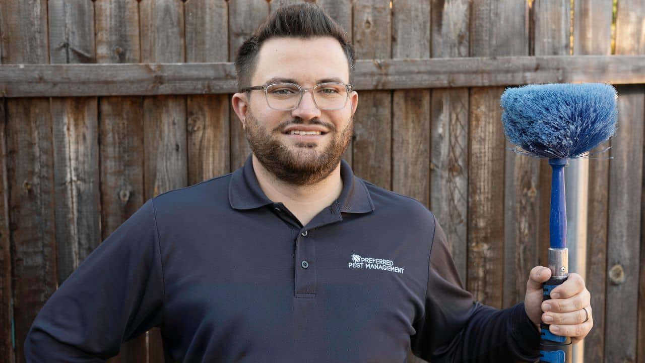 Preferred Pest Management technician with pest-control equipment